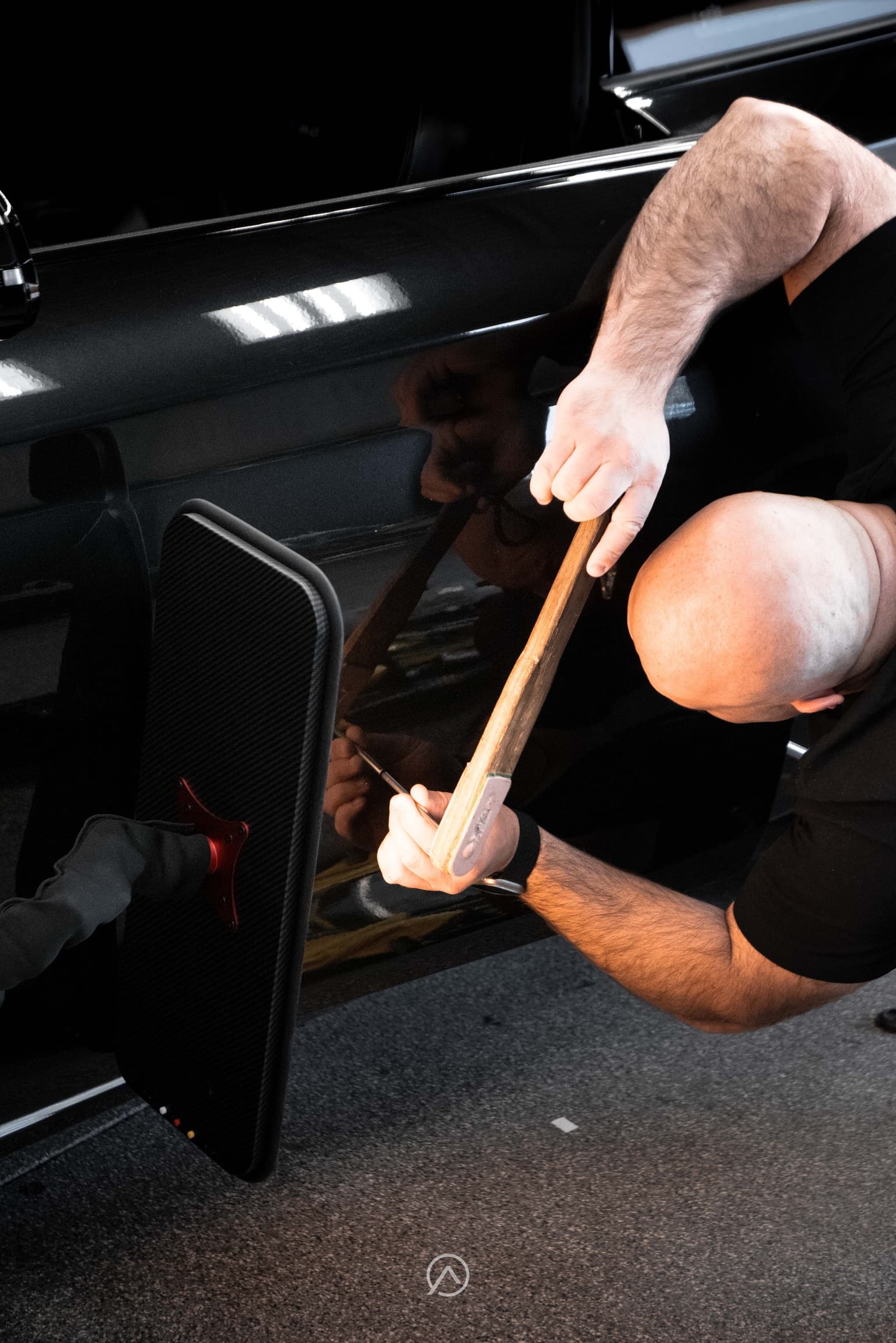 Advance technician performing paintless dent repair